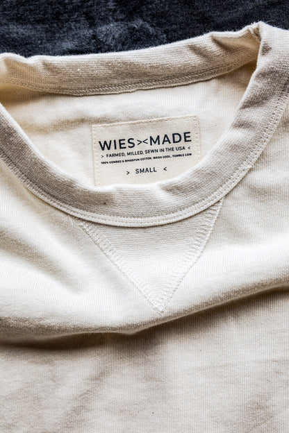 Close-up of natural cotton rugby jersey pullover collar with WiesMade USA-made label and V-stitch detail.