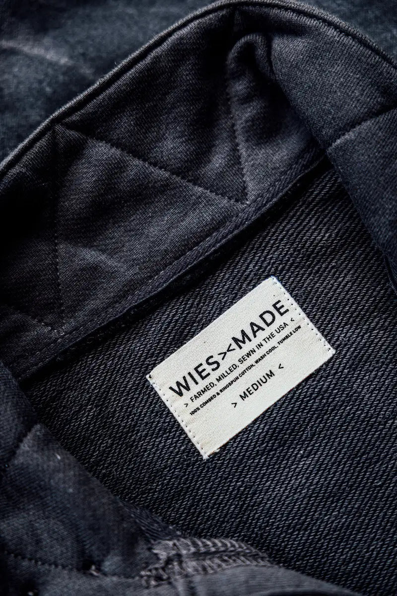 Inside quilted lining and cream WiesMade label on the basalt moto jacket, sewn in the USA.