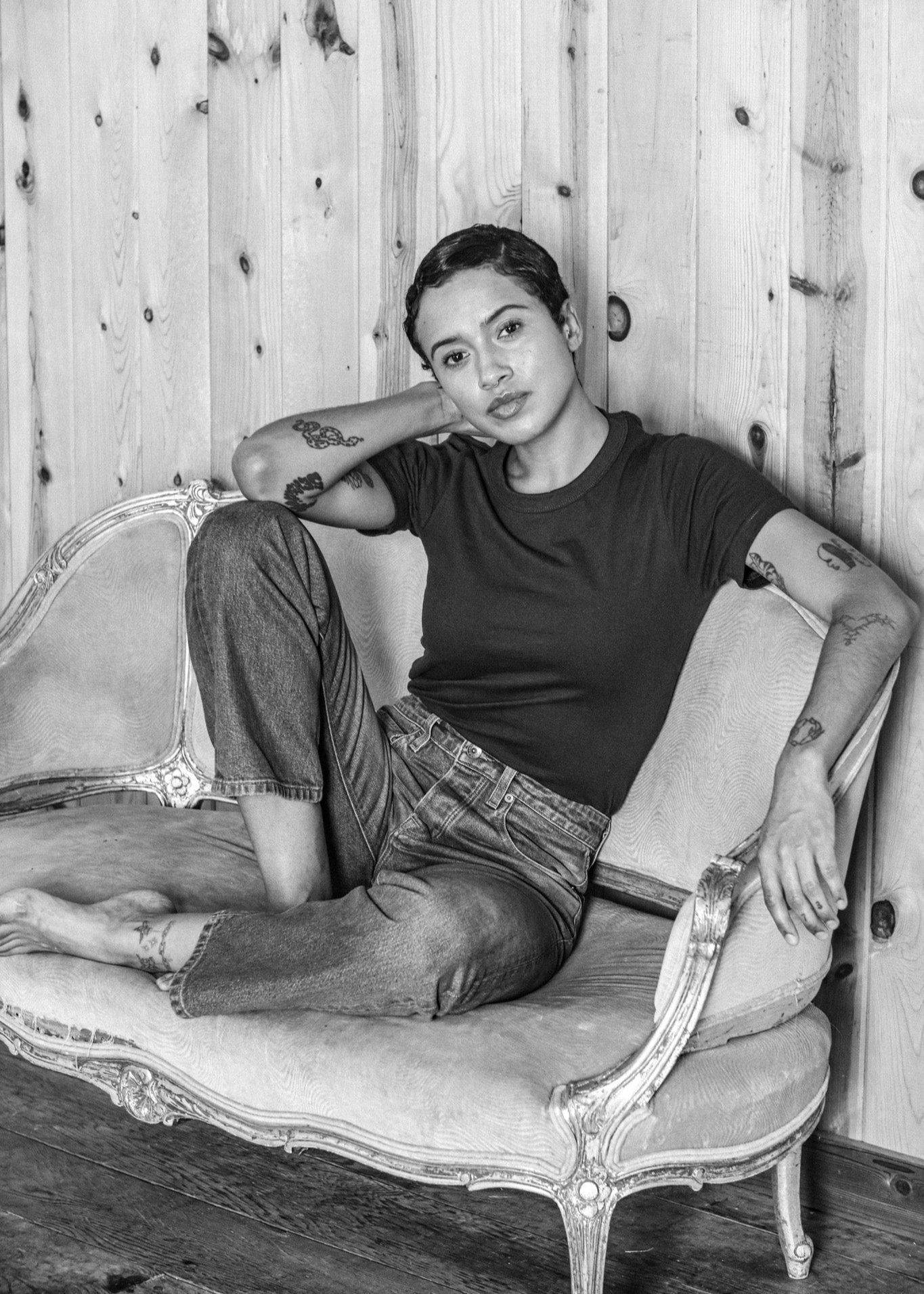 Women’s designer mid-rise denim jeans styled with a fitted tee, featuring a relaxed straight leg cut and classic five-pocket design for a clean, minimalist aesthetic