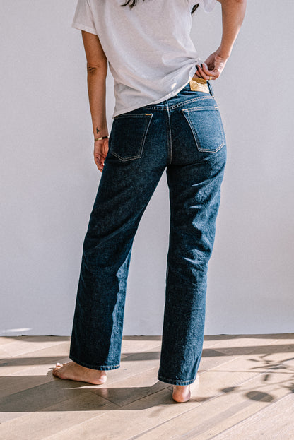Back view of Jackie ocean wash wide-leg jeans with contrast stitching and leather patch.