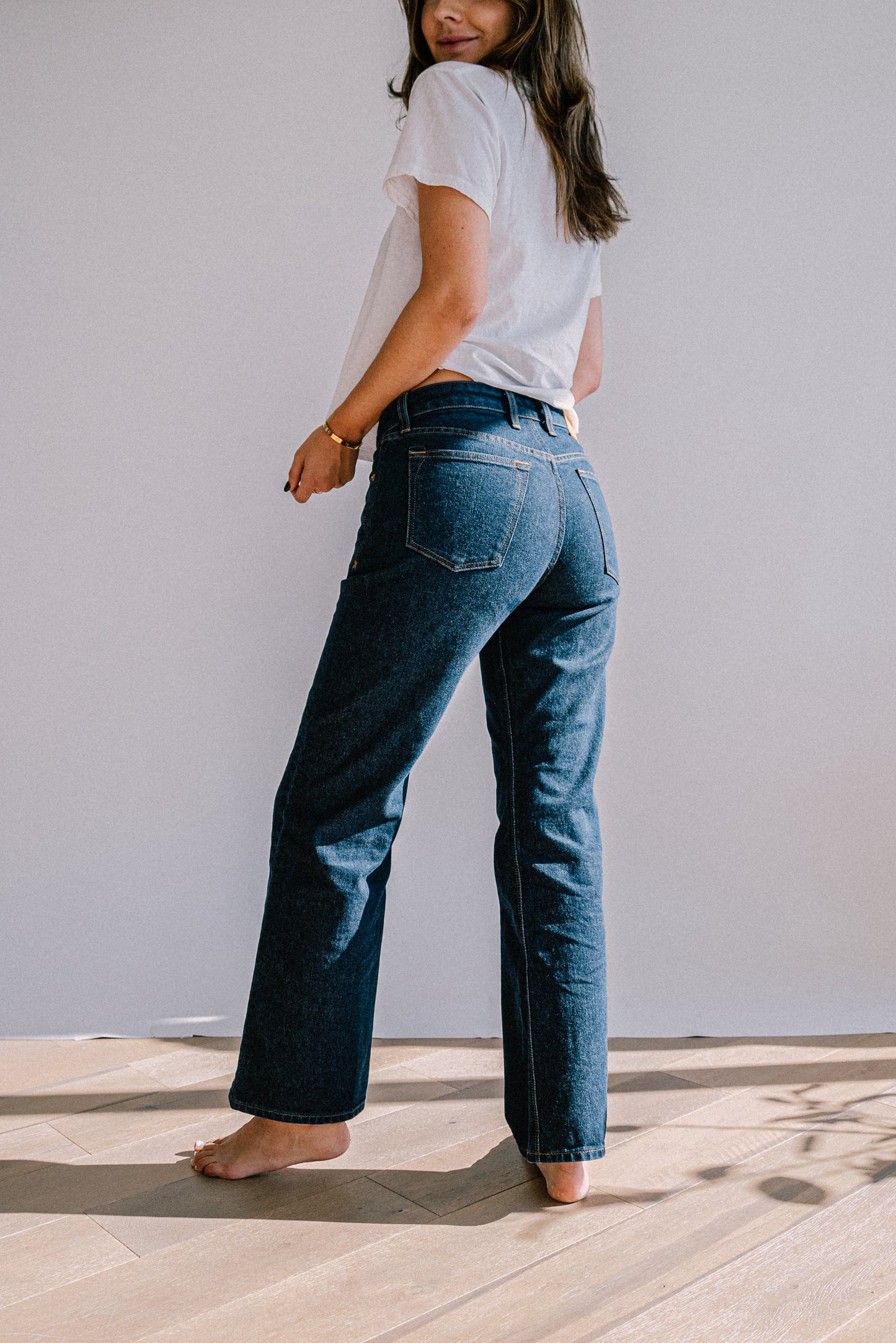 Back view of Jackie ocean wash wide-leg jeans showing five-pocket styling and mid-rise fit.