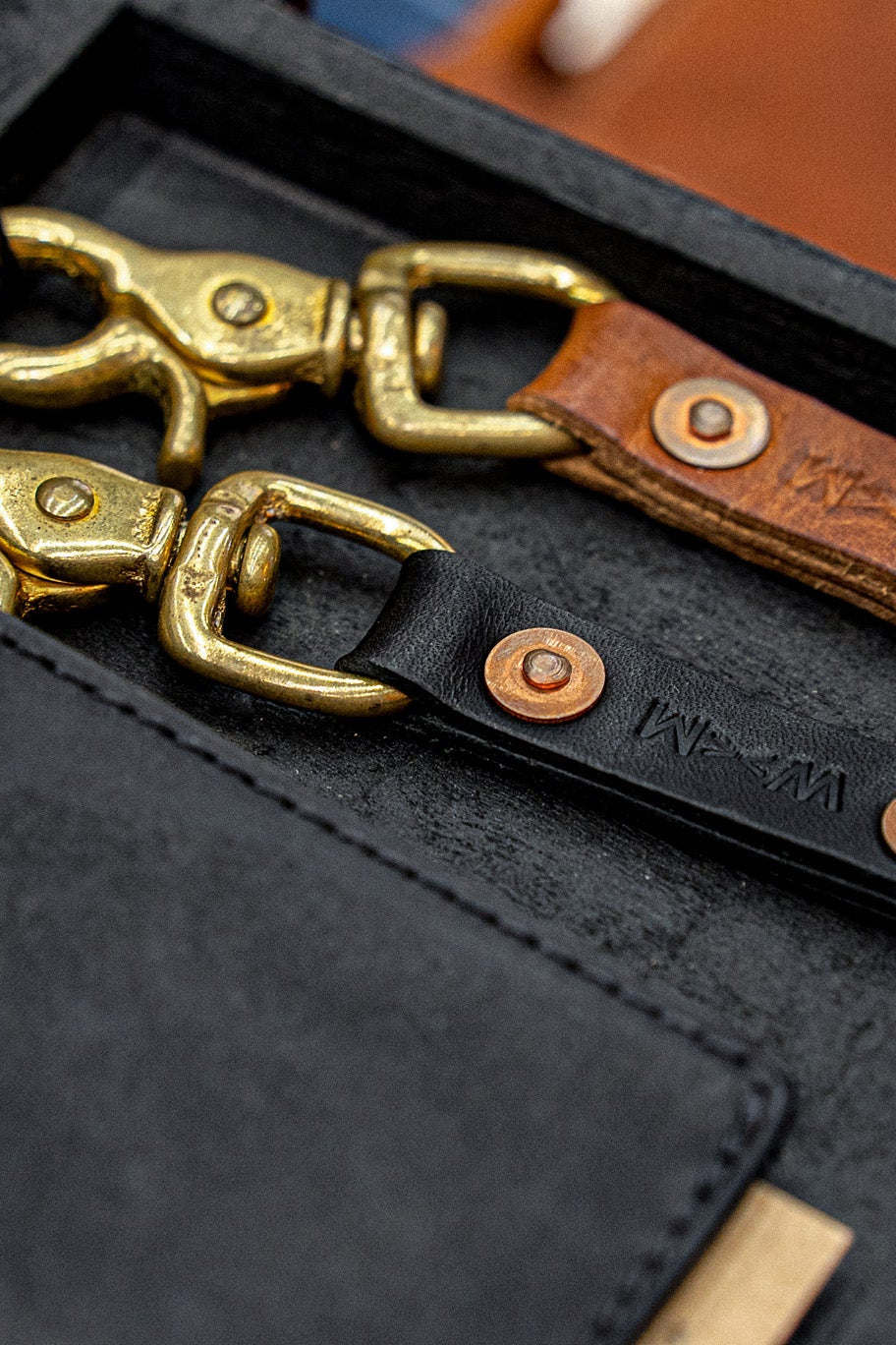 Black Horween leather key clip with polished brass swivel clasp and copper rivet, WiesMade embossed.