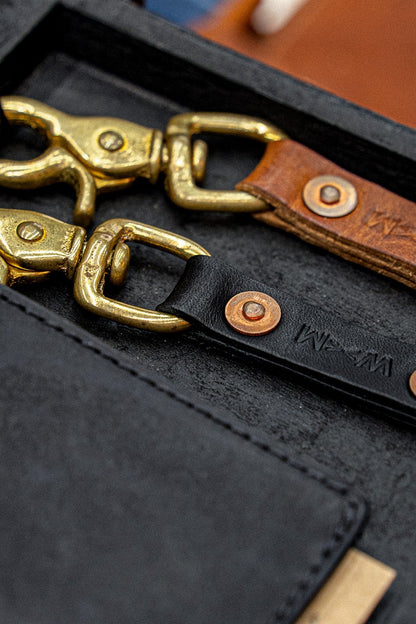 Black Horween leather key clip with polished brass swivel clasp and copper rivet, WiesMade embossed.
