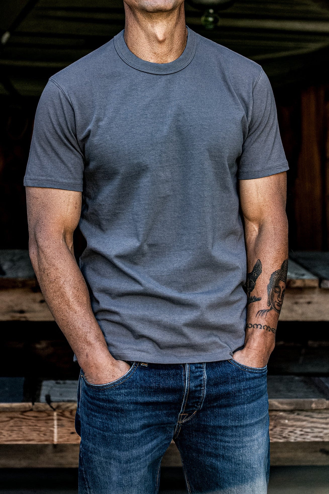 Pebble heavyweight cotton t-shirt on a man with dark blue jeans, hands in pockets.