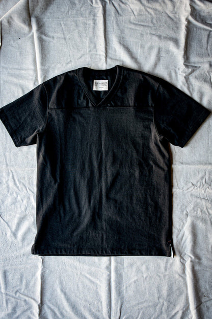 Basalt 12oz cotton V-neck jersey tee laid flat on a linen backdrop.