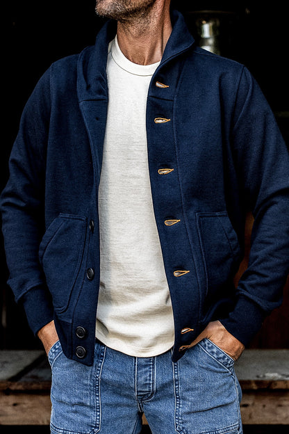Navy French terry Bodega cardigan worn open over a cream tee with jeans.