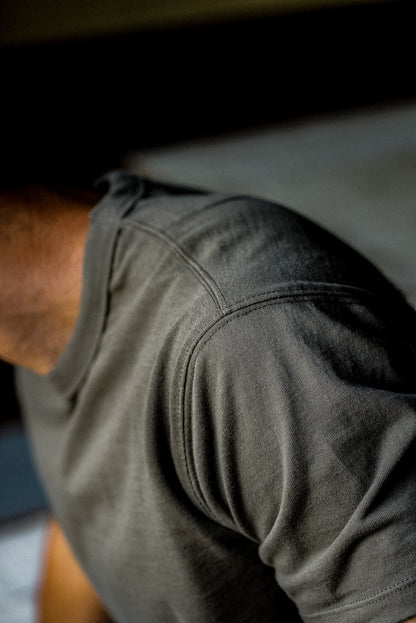 Close-up of the tailored shoulder seam on the olive heavyweight cotton Bolinas tee.