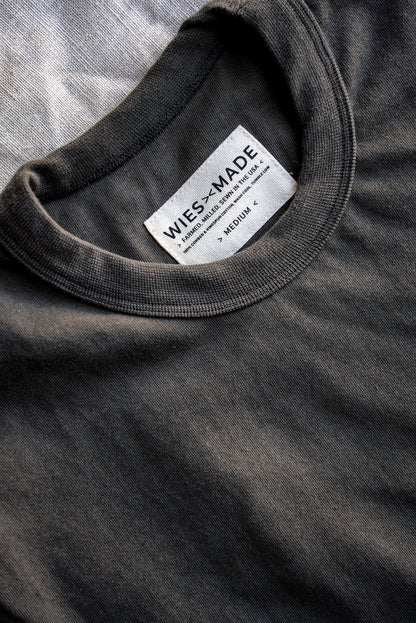 Close-up of olive Bolinas heavyweight tee collar with WiesMade USA-made cotton label.