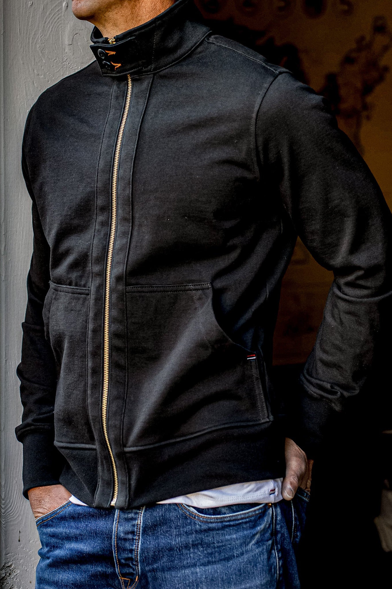 Basalt Stinson moto jacket in 12oz cotton with brass zipper, worn over jeans.