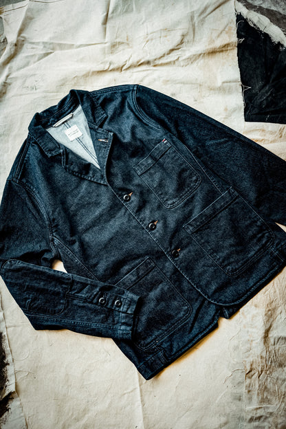 Men's Scout denim chore blazer in ocean indigo, flat-laid on canvas with patch pockets.