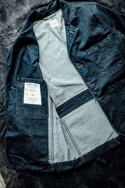Men's denim blazer laid open to show interior lining, inside chest pocket, and WiesMade Scout size M label.