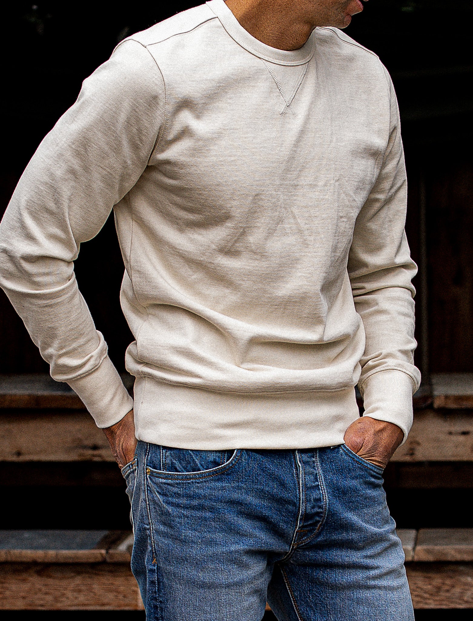 Natural cream Stinson crewneck rugby jersey pullover worn with blue denim jeans.