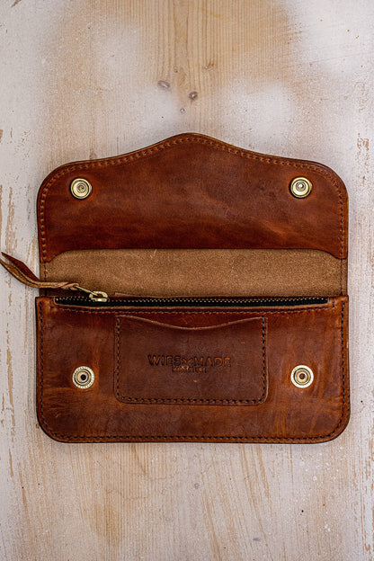 Open tan Horween leather Roper wallet showing brass snaps, zip pocket, and WiesMade stamp.