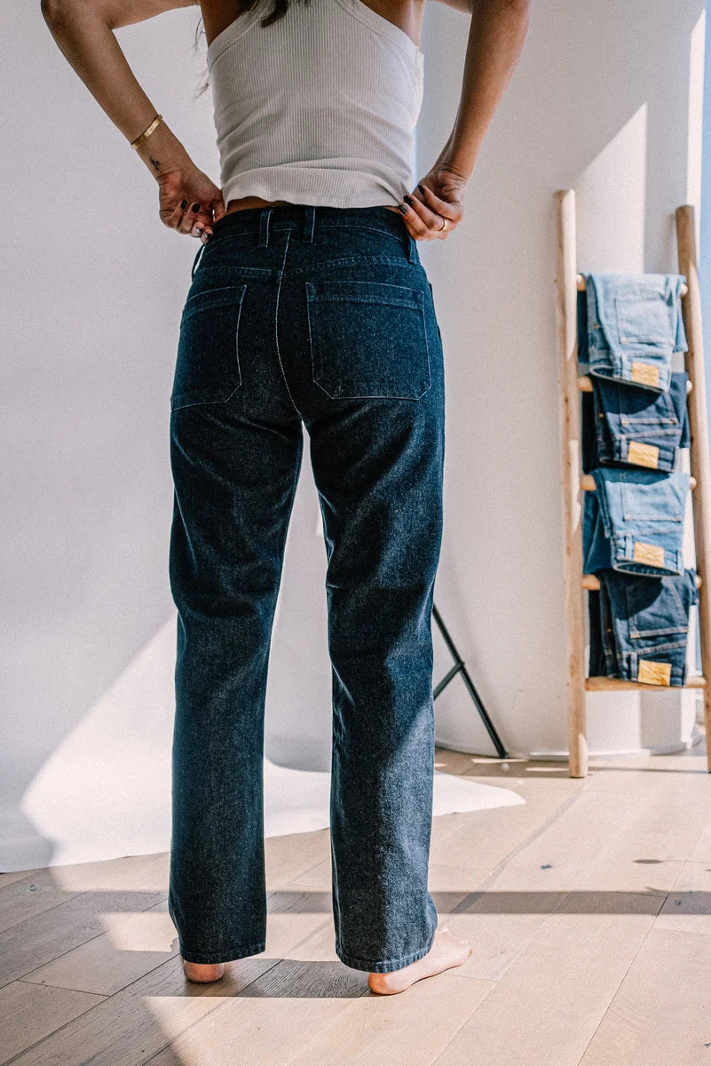 American made denim jeans shown from the back, featuring a straight leg cut, clean stitching, and premium dark wash for a classic, durable fit