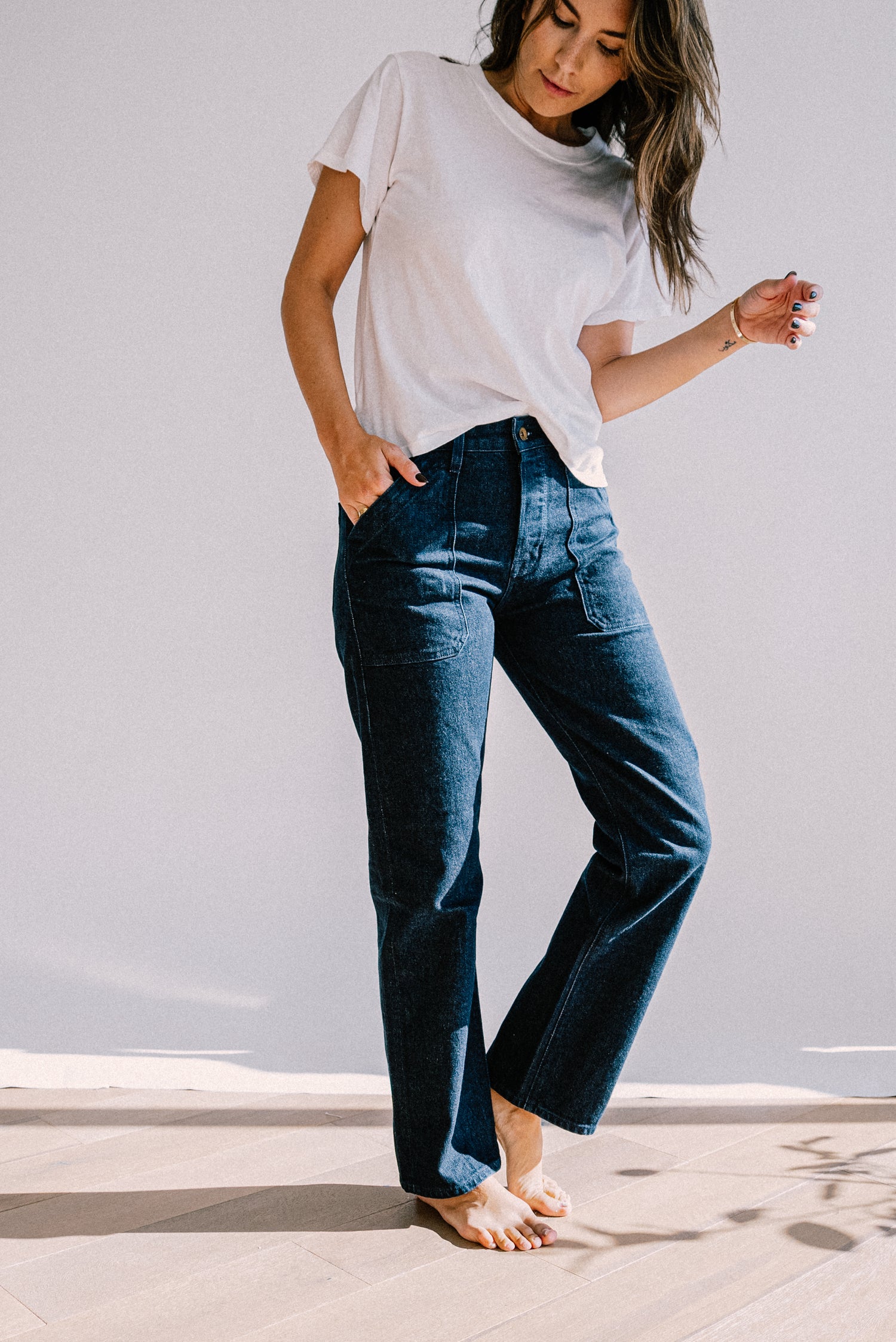 American made ocean wash jeans for women, featuring a high rise fit, straight leg cut, and front utility pockets for a refined yet casual everyday look