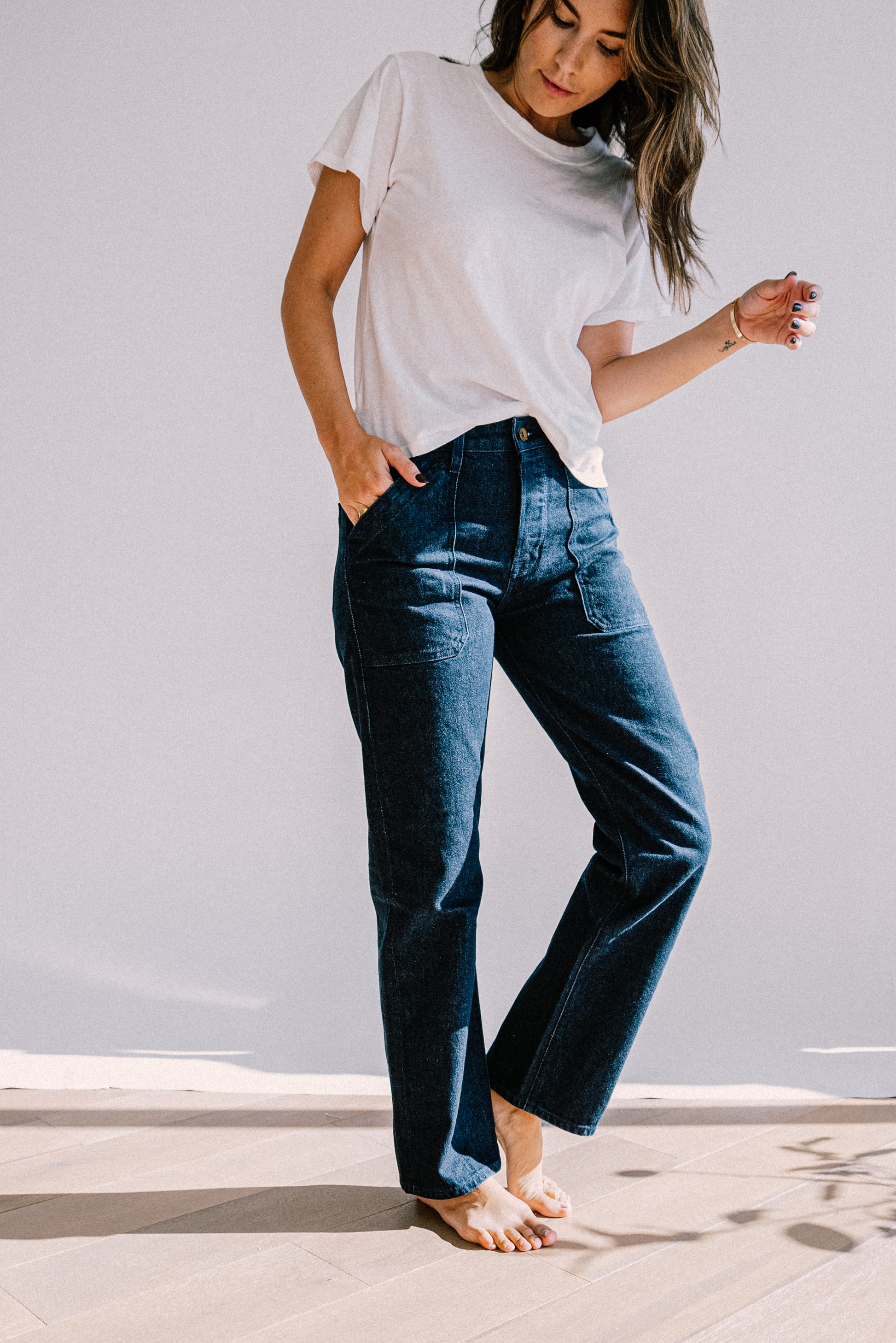 American made ocean wash jeans for women, featuring a high rise fit, straight leg cut, and front utility pockets for a refined yet casual everyday look