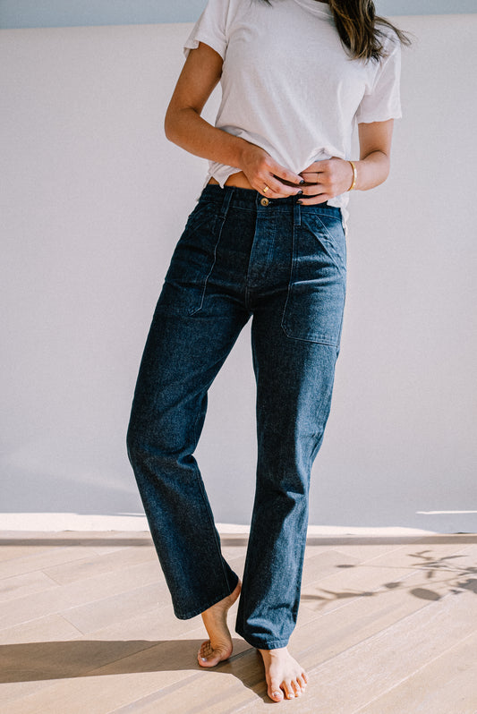 Women’s premium ocean wash jeans with a high rise fit and front utility pockets, styled with a white tee for a casual, modern look