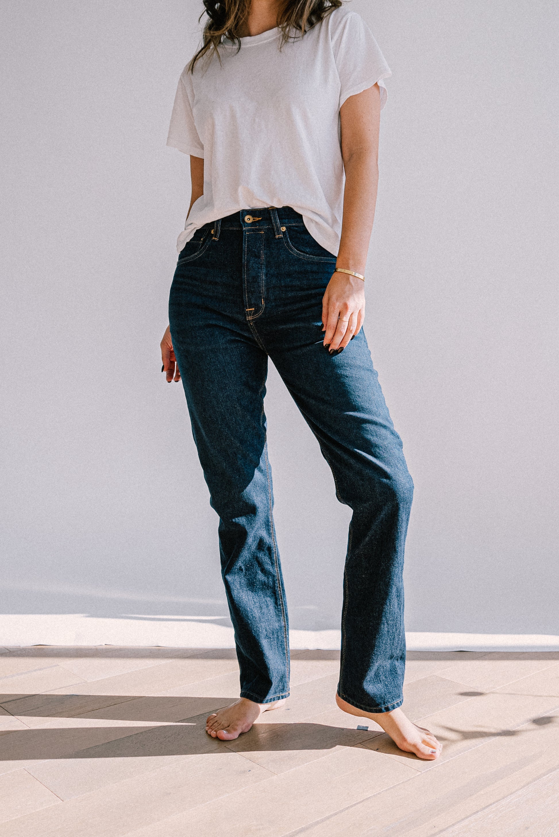 High-rise straight-leg ocean wash American made jeans styled with a white tee.