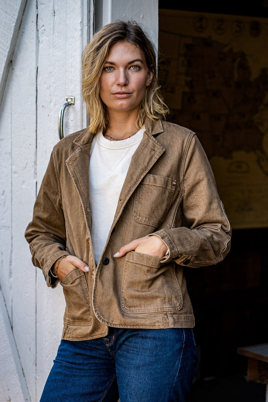 Wheat denim chore blazer worn open over a white tee with jeans, on-model.