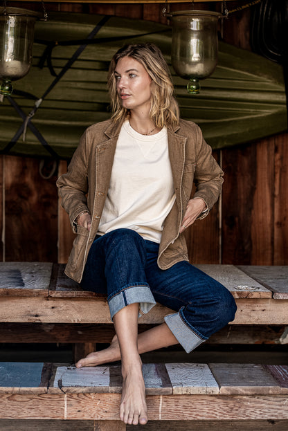 Model wearing wheat Scout denim chore blazer over a cream tee with cuffed jeans.