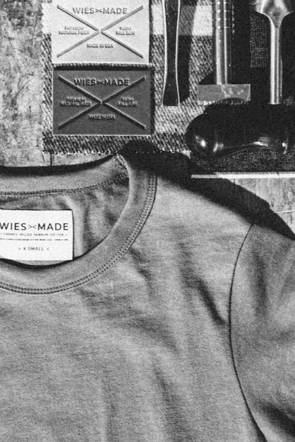 Close-up of Bolinas heavyweight cotton tee neckline with WiesMade Made in USA label in size XS.