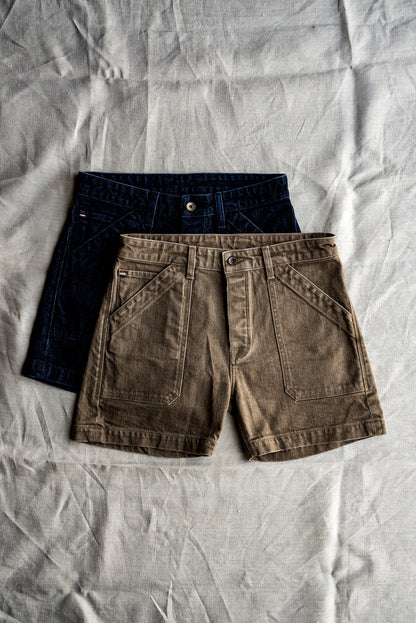 Scout military shorts in ocean wash denim layered over an olive pair on linen.