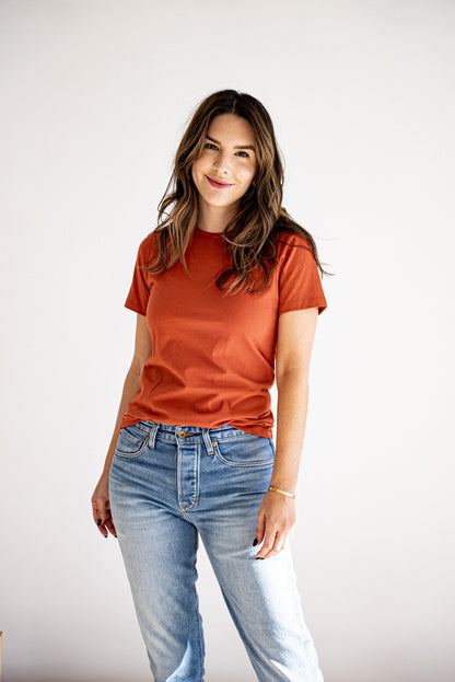 Women's Bolinas heavyweight tee in brick, styled with light-wash jeans against a white backdrop.