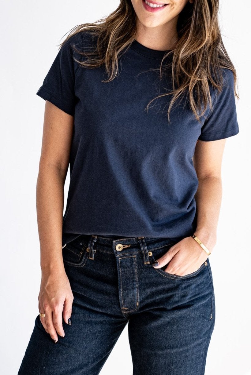 Women's Reyes boxy tee in dark Polar navy, styled with raw denim jeans.