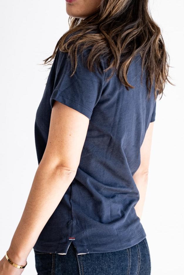 Back view of the Reyes boxy tee showing relaxed fit, short sleeves, and twill-lined side vent with bartack detail.