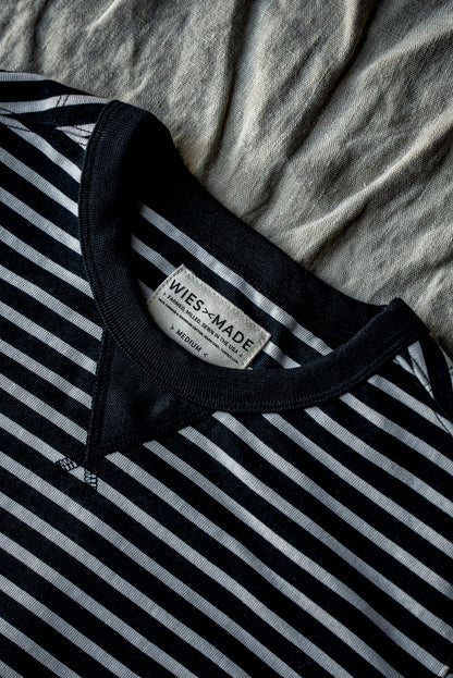 Close-up of black and white striped Stinson pullover neckline with WiesMade size medium label.