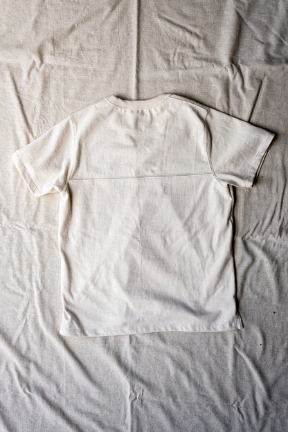 Natural cotton Stinson V-neck jersey tee laid flat, back view showing yoke seam.
