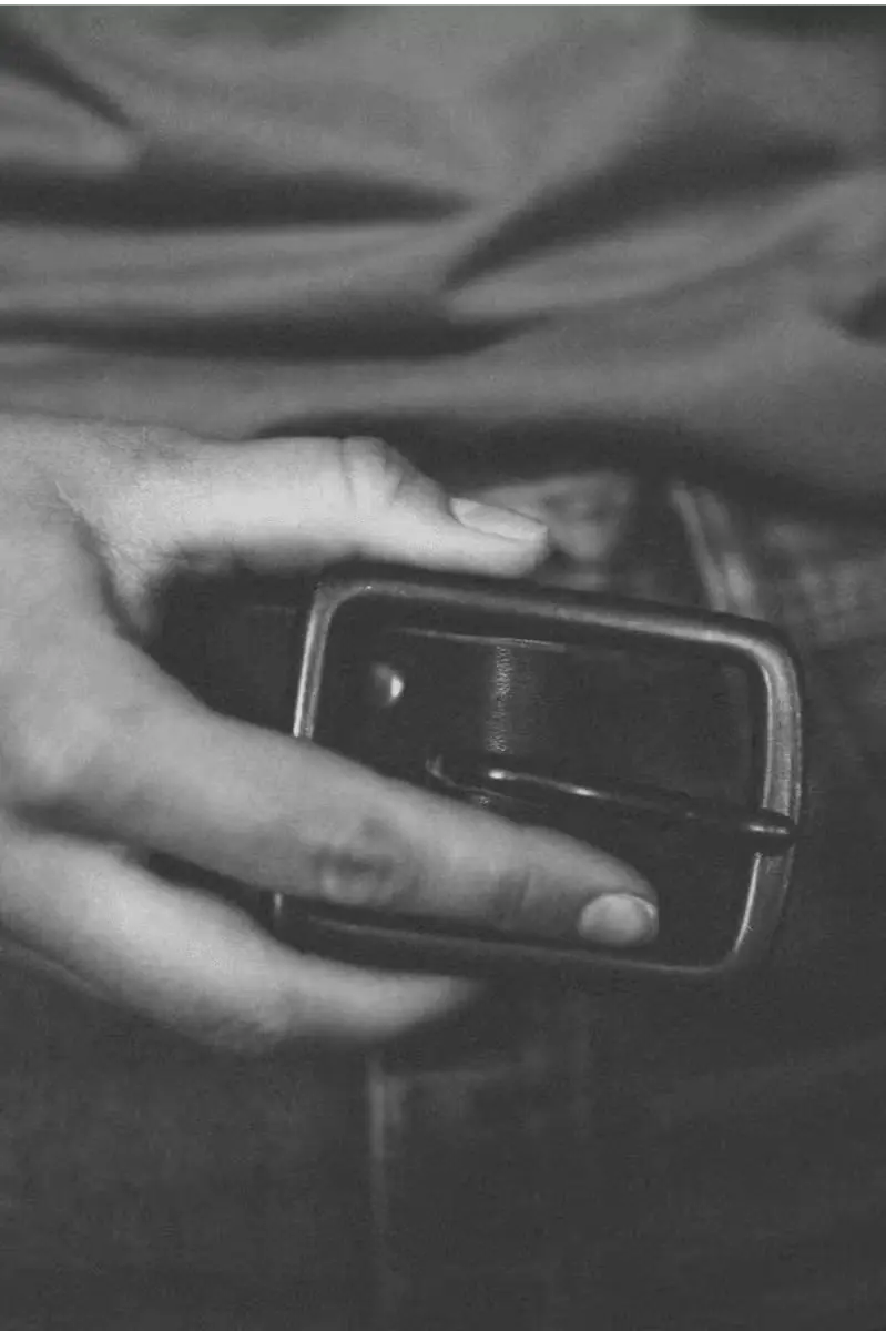Latigo Belt made from 1.5” 8oz American Latigo leather, shown in a black & white filter with hand detail